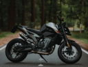 black and silver naked motorcycle on road during daytime